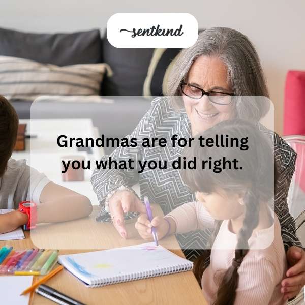 A smiling grandmother gently holds her grandchild's hands while offering words of encouragement.