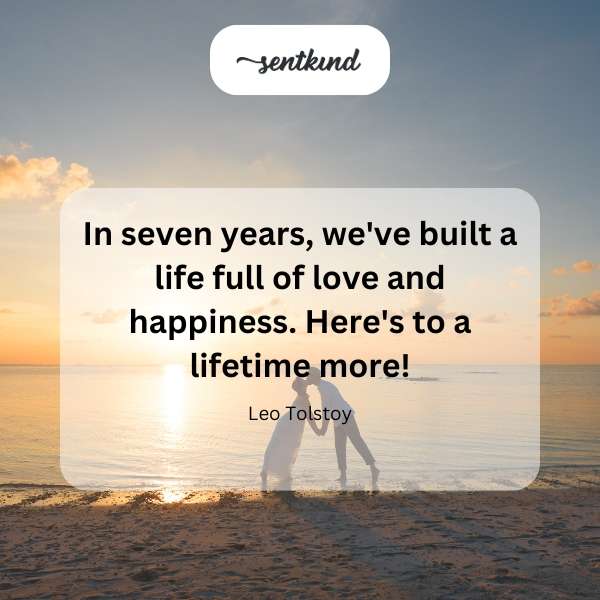 Couple holding hands on a sunny beach, symbolizing enduring love.