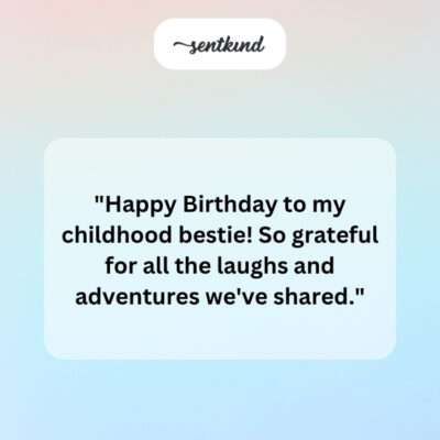 A couple smiling and laughing while celebrating a birthday with cake and candles.