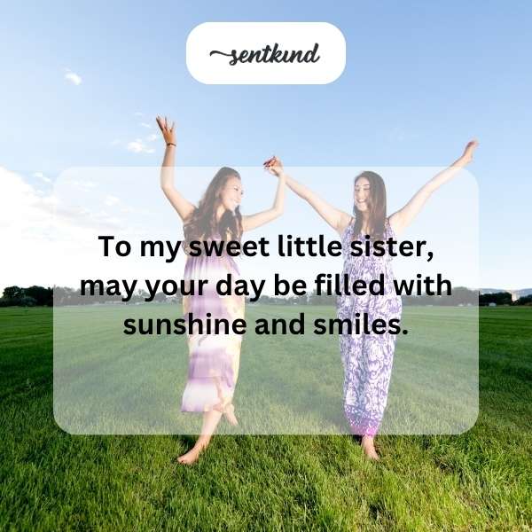 A young girl smiles brightly surrounded by sunflowers.