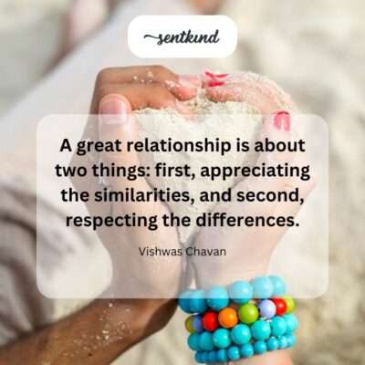 A close-up view of two distinct hands gently connecting, symbolizing unity in difference.