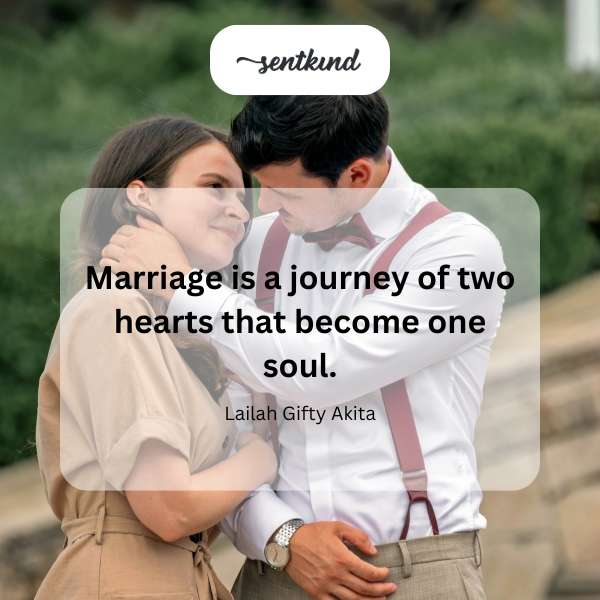 Two hands intertwine, symbolizing the union of marriage.