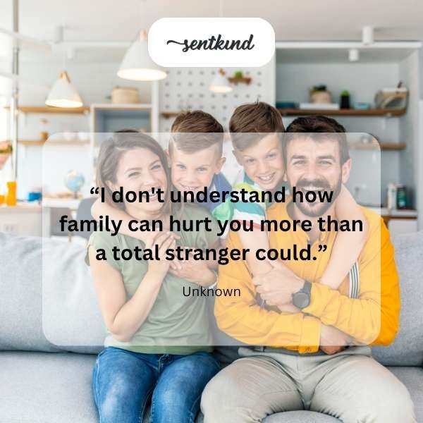 A person sits alone with a pained expression, while a blurry group of figures stands distantly behind them, representing family.