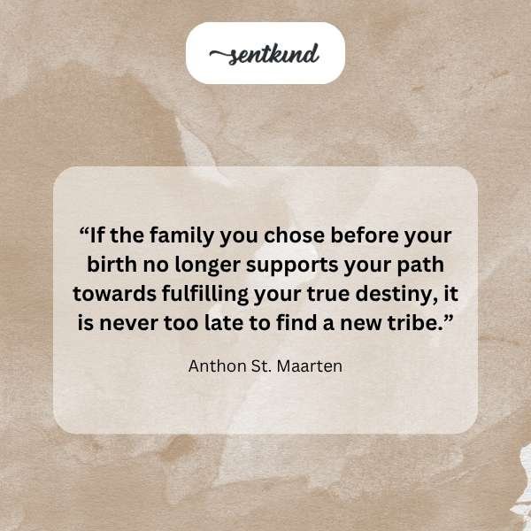 A diverse group of people smiling and embracing in a warm setting, symbolizing the strength of chosen family connections.