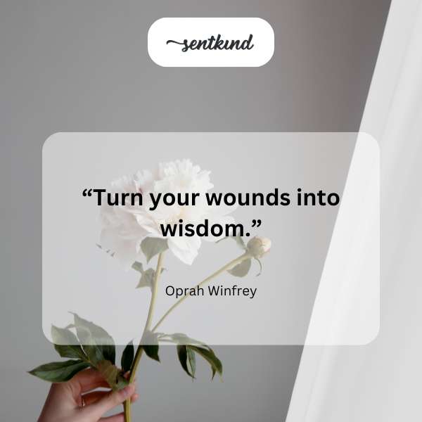 An inspirational quote overlaying a serene image of a blooming flower.