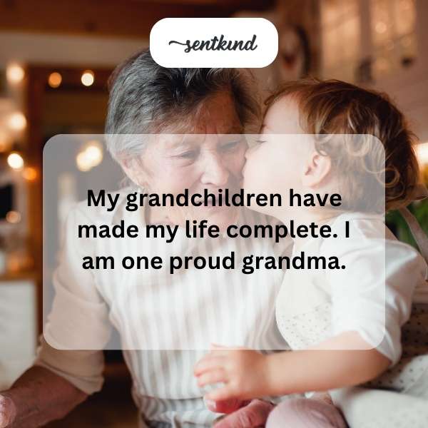 A proud grandmother smiles brightly while embracing her young grandchildren.