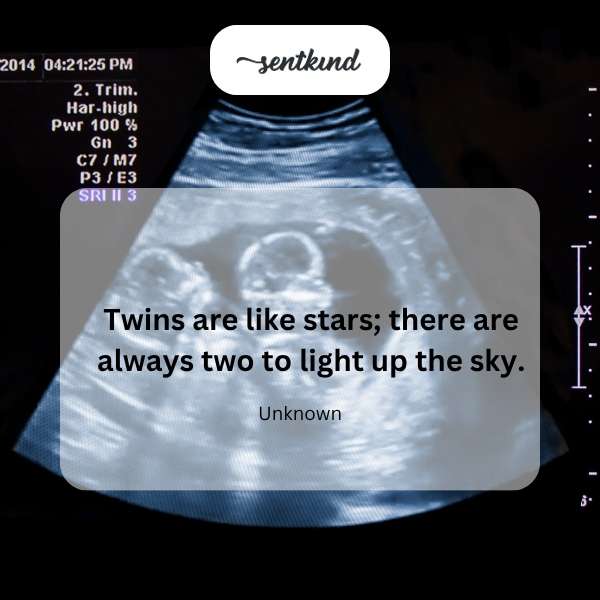 Two children, likely twins, are holding hands and looking up at a starry night sky.