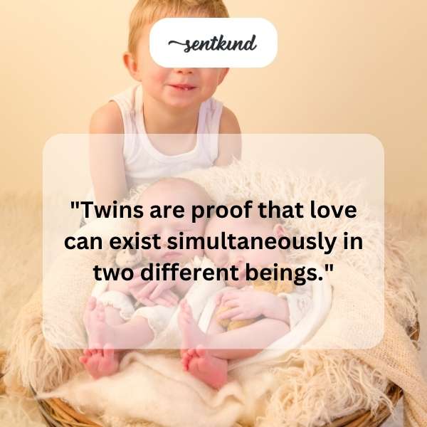 Two newborn babies, possibly twins, are lying side by side in a hospital incubator.