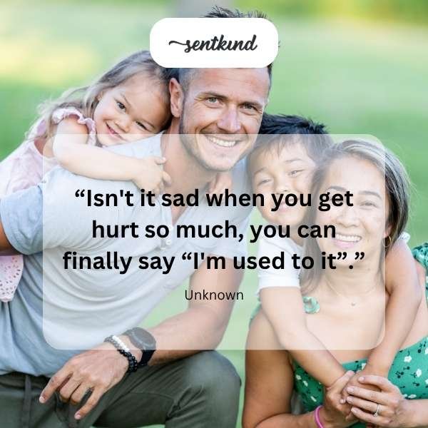 A person's hand reaches out towards another hand, which is withdrawn, against a blurred background symbolizing emotional distance and pain.