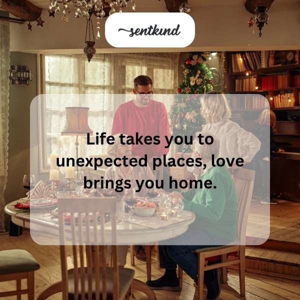 Person smiling warmly while hugging someone at the entrance of a cozy house.