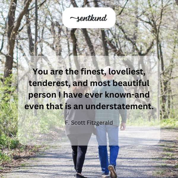 Elegant script of a romantic quote overlaying a soft, dreamy background.