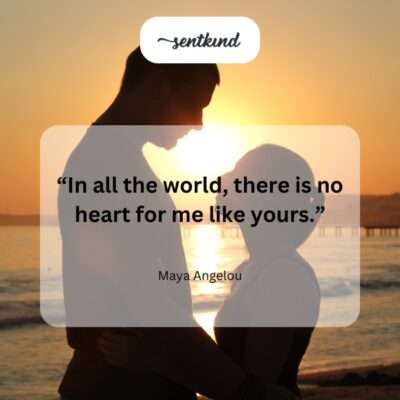 Two figures silhouetted against a setting sun, holding hands and looking out at the horizon.
