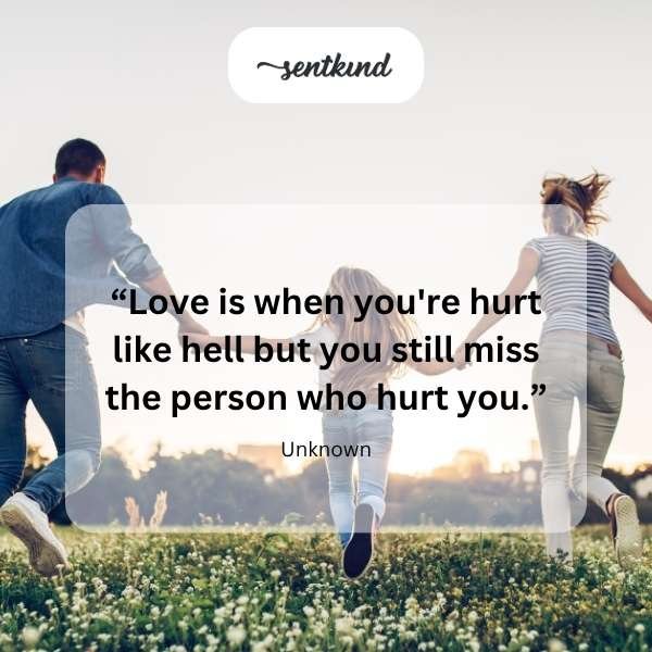 A person sits alone on a park bench, looking down with a weary expression that reflects emotional pain and resilience.