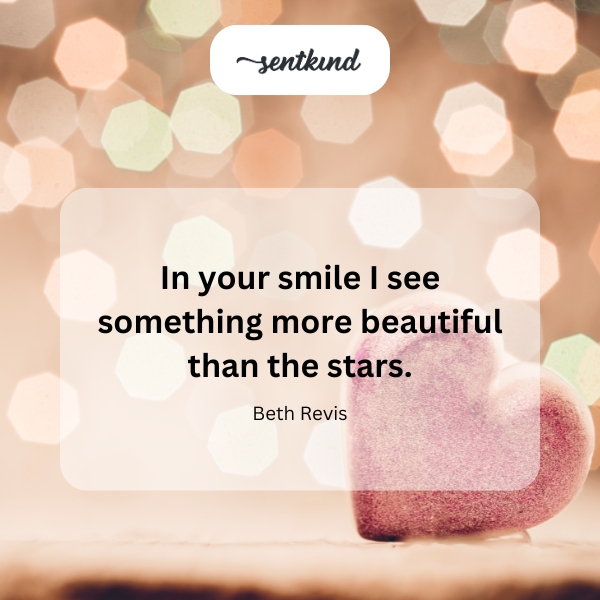 A person smiles warmly, their face softly illuminated by bokeh lights resembling stars.