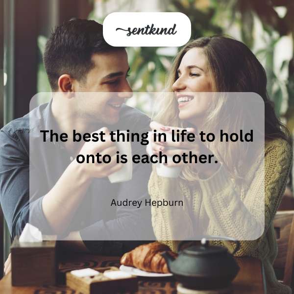 Two people holding hands, symbolizing connection and support.