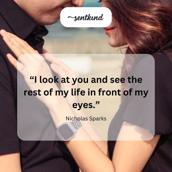 A couple gazes lovingly into each other's eyes.
