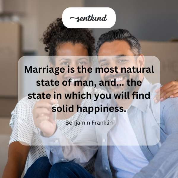 A couple joyfully embraces at their wedding ceremony.