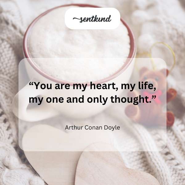 A heart-shaped locket rests on an antique book.