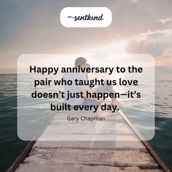 Two champagne flutes are touching in a celebratory toast against a softly blurred background.