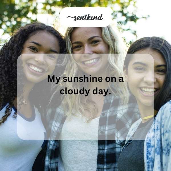 A person smiles brightly, their eyes crinkling at the corners, indicating genuine happiness.