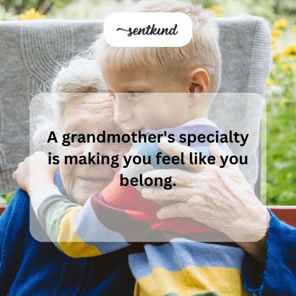 A grandmother is lovingly embracing her grandchild on a comfortable sofa.