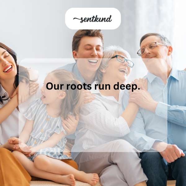A multigenerational family embraces tightly, laughing together.
