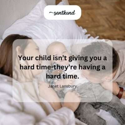 A parent kneels down to gently hold and comfort their crying child.