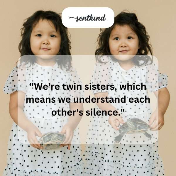 Identical twin sisters stand side-by-side, facing forward with a knowing look.