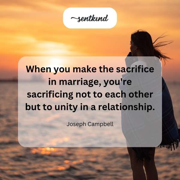 Two intertwined wedding rings symbolize commitment and unity.