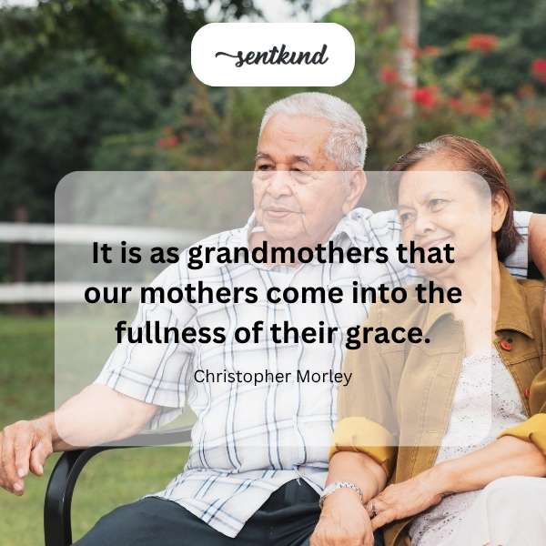 A grandmother with gentle eyes smiles warmly while holding her grandchild's small hand.