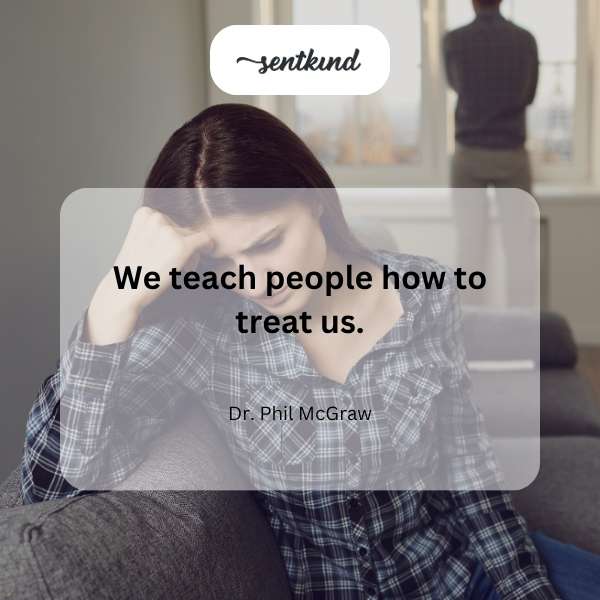 A person holding a sign with the phrase about teaching others how to treat you.