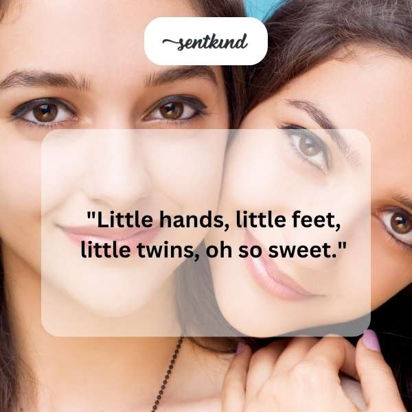 A close-up photo of tiny newborn twin feet and hands.