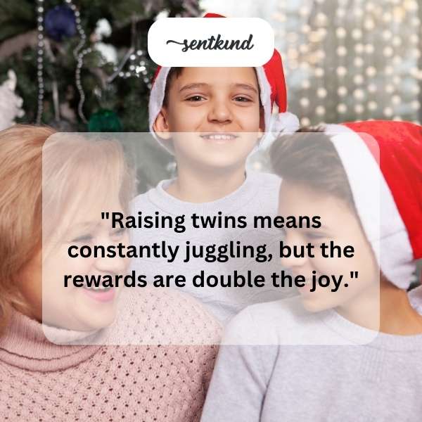 Two babies sitting side-by-side smiling.