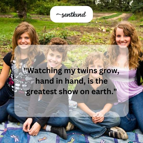 Two young children, presumably twins, are walking side-by-side holding hands in a park.