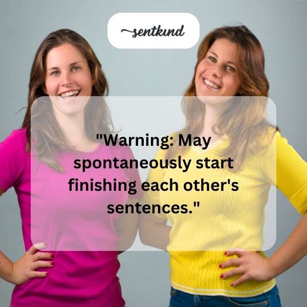 Two people smiling and facing each other, possibly about to speak in unison.