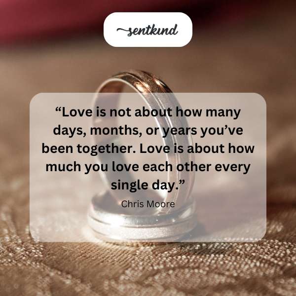 Heart-shaped stones arranged on a sandy beach symbolize enduring love.