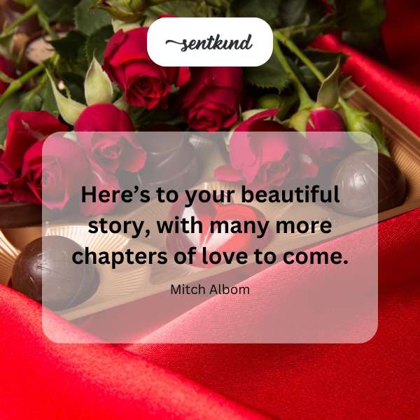 An open book with a heart-shaped bookmark sits on a soft blanket.