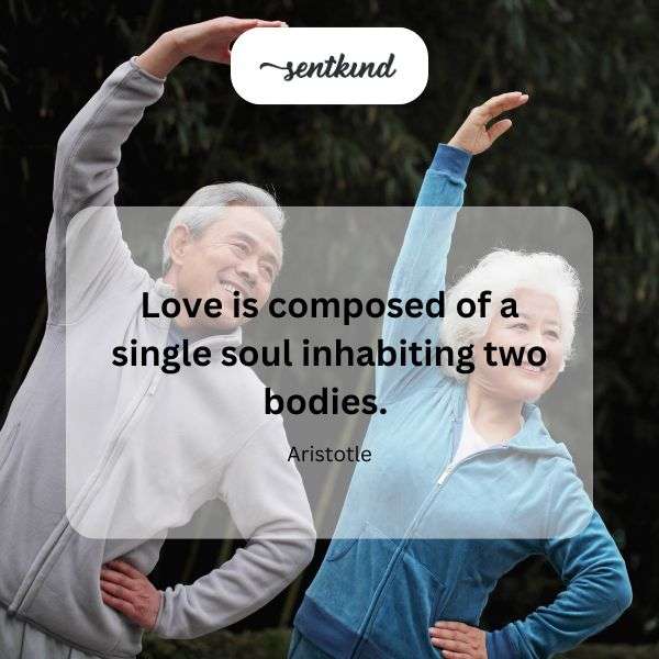 Two figures embrace, forming a heart shape with their bodies.