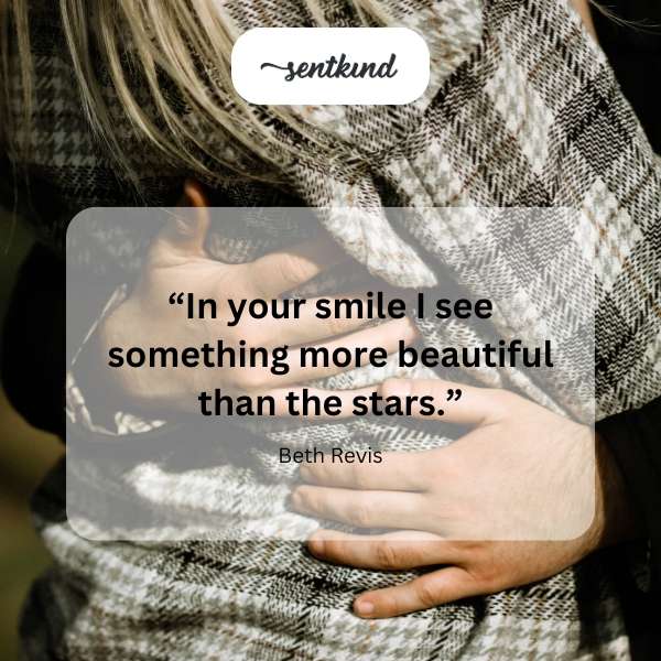 Smiling person with starlight reflected in their eyes.