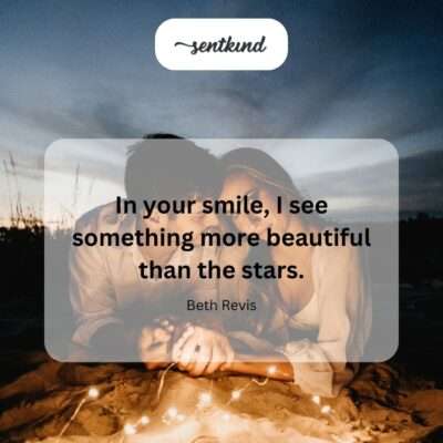Close-up photo of a person smiling gently under a clear night sky filled with bright stars.