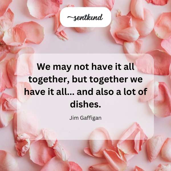 A large pile of dirty dishes sits precariously stacked in a kitchen sink.