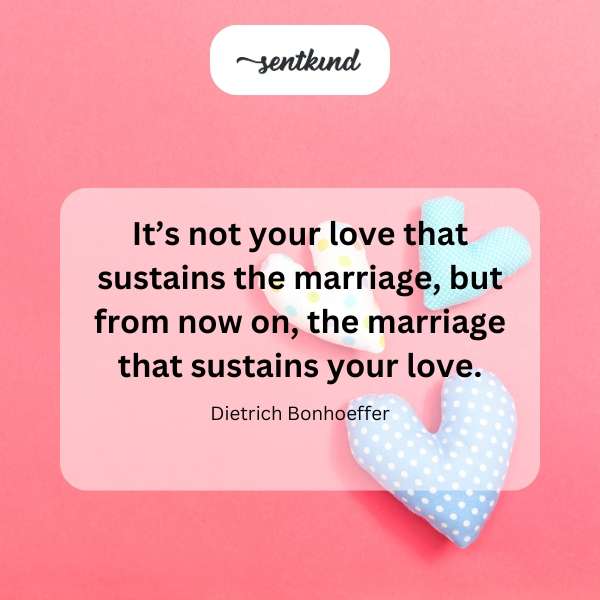 A wedding band rests on an open book about marriage.