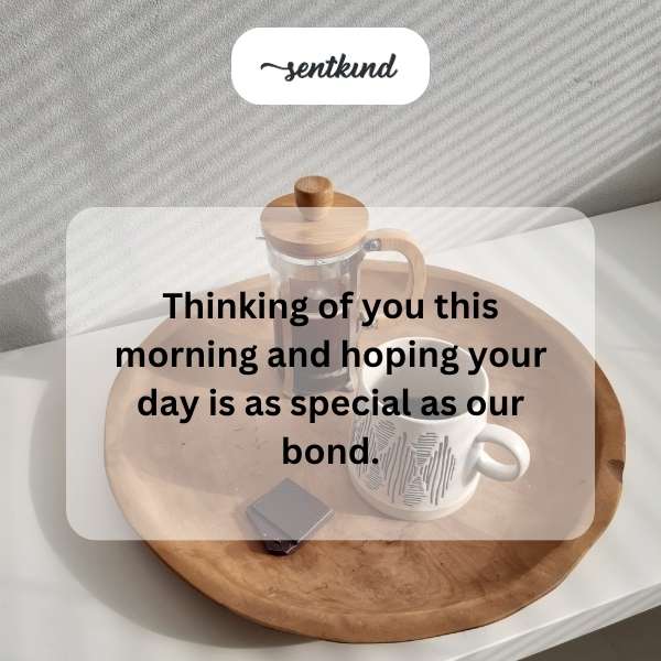 A steaming mug sits on a wooden windowsill bathed in warm morning light, suggesting comfort and reflection.