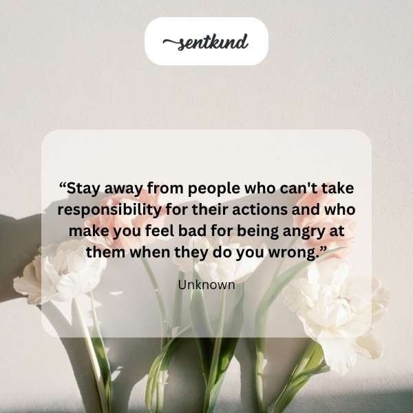 A person is seen struggling to repair a heavily tangled and broken metal chain with their bare hands.