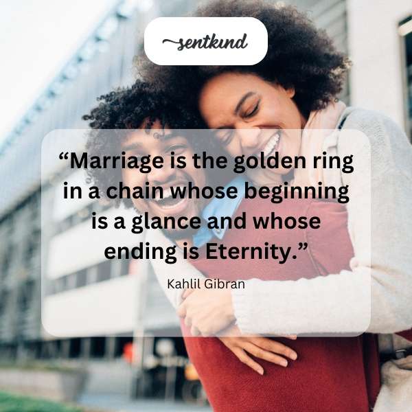 A golden ring is centered, with a blurred background showing intertwined hands.