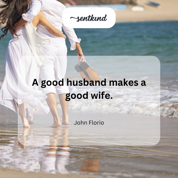 A happy couple is sharing a laugh while sitting close together on a park bench.