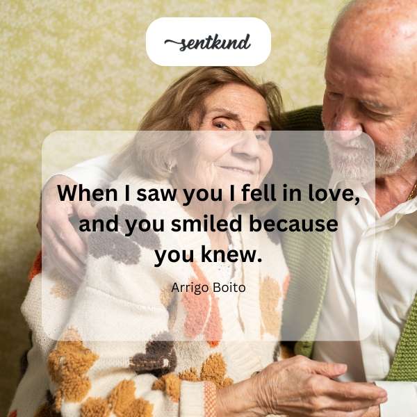 A couple gazes at each other with deep affection and knowing smiles.