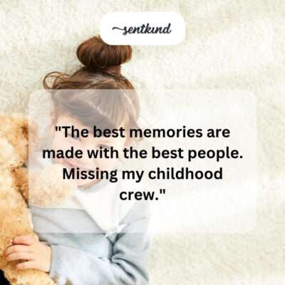 A person is holding a stack of old, faded photographs in their hands, looking at them with a thoughtful expression.