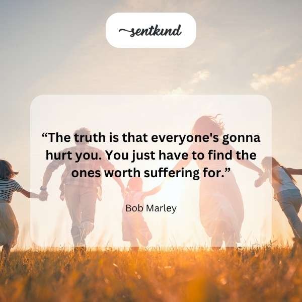 A family stands together smiling warmly, symbolizing the enduring value of relationships over material wealth.