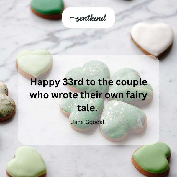 A happy couple smiles while cutting their wedding cake.